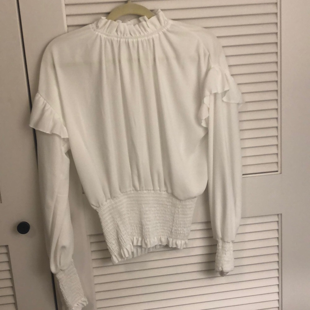 White ruffle long sleeve blouse
